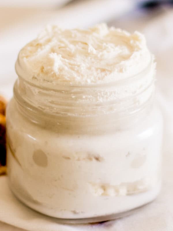 Homemade hand cream in a small glass jar.