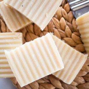 Beeswax soap bars on a wicker mat.