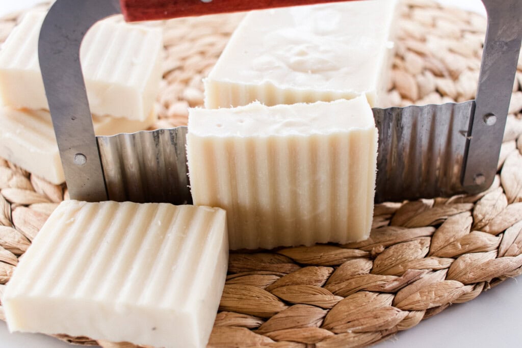 Cutting soap with a soap cutter.