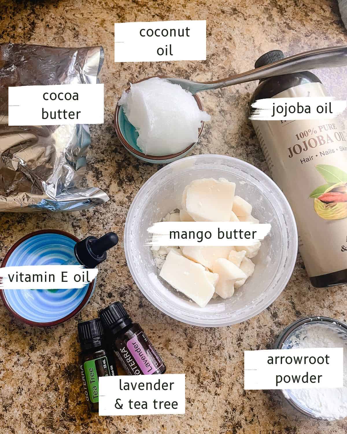 Ingredients for homemade body butter on a kitchen counter labeled.