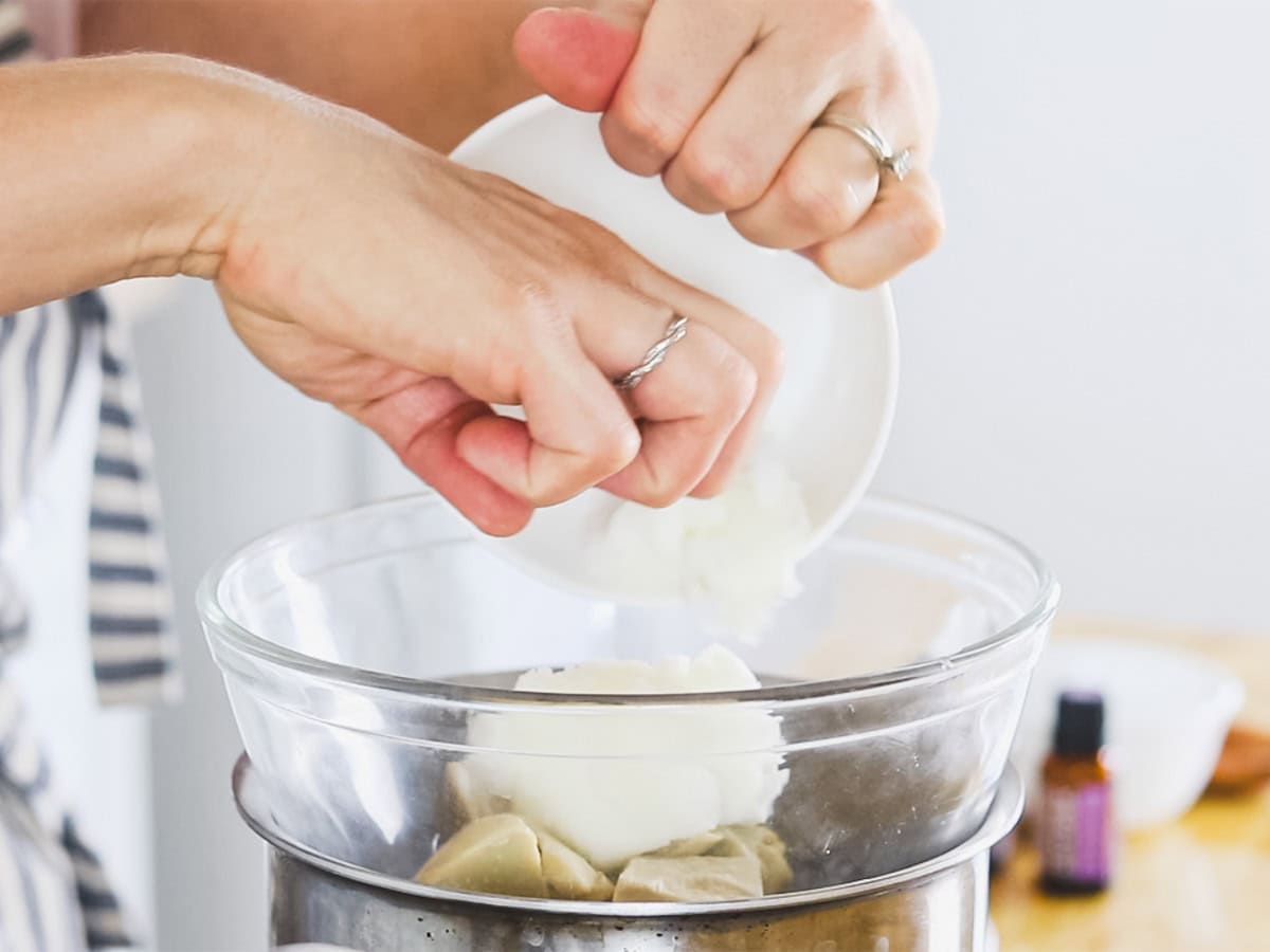 Putting homemade body butter ingredients in a double boiler. 