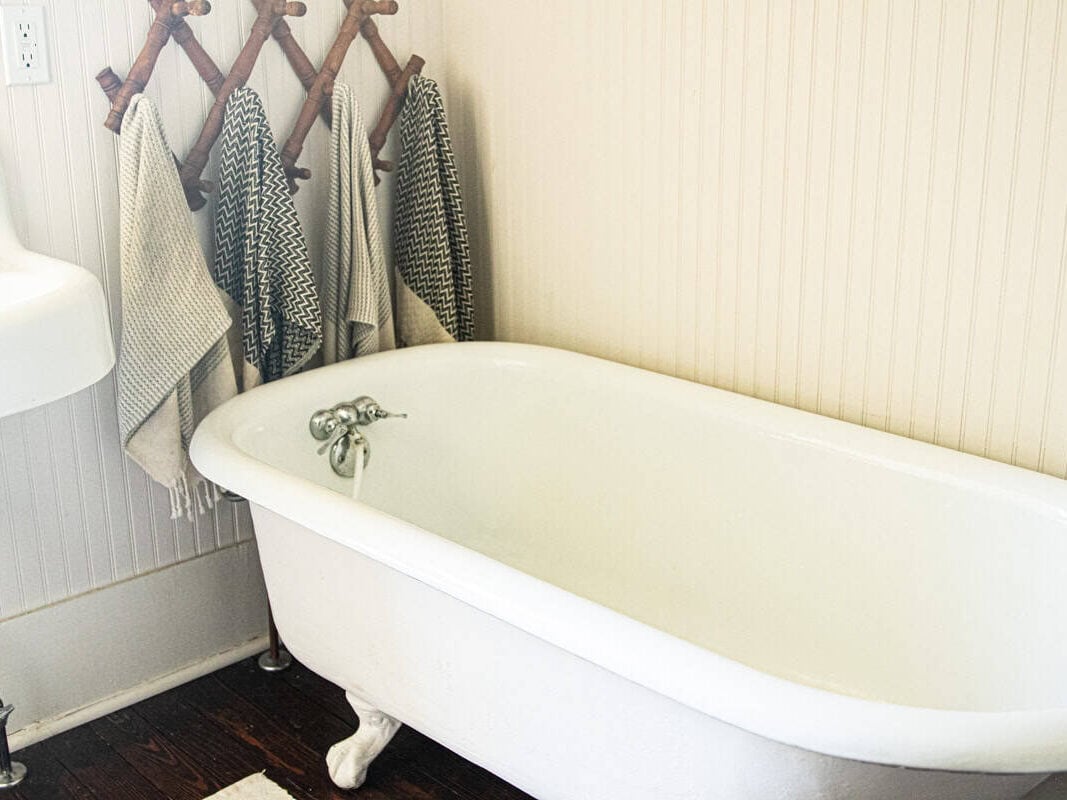 A claw foot bathtub in a bathroom. 