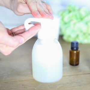 Dispensing some natural baby wash into the hand.