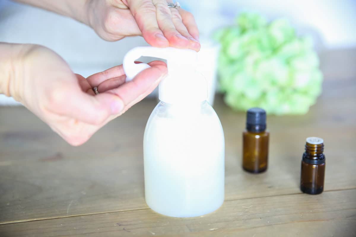 Dispensing some natural baby wash into the hand.