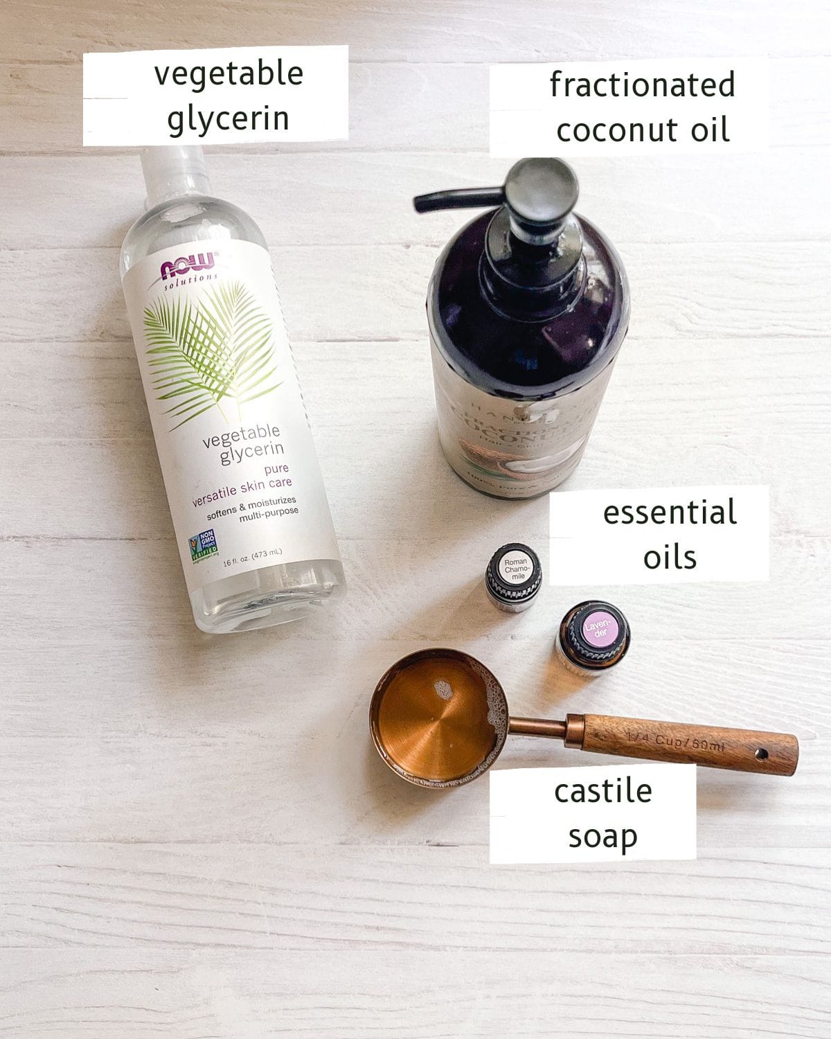 Homemade baby wash ingredients labeled on a white table.
