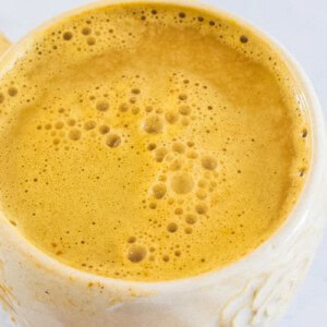 Looking down on a mug of pumpkin spice latte.