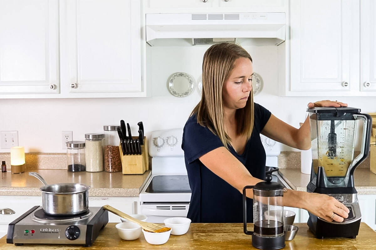 Blending a pumpkin spice latte in a stand blender.