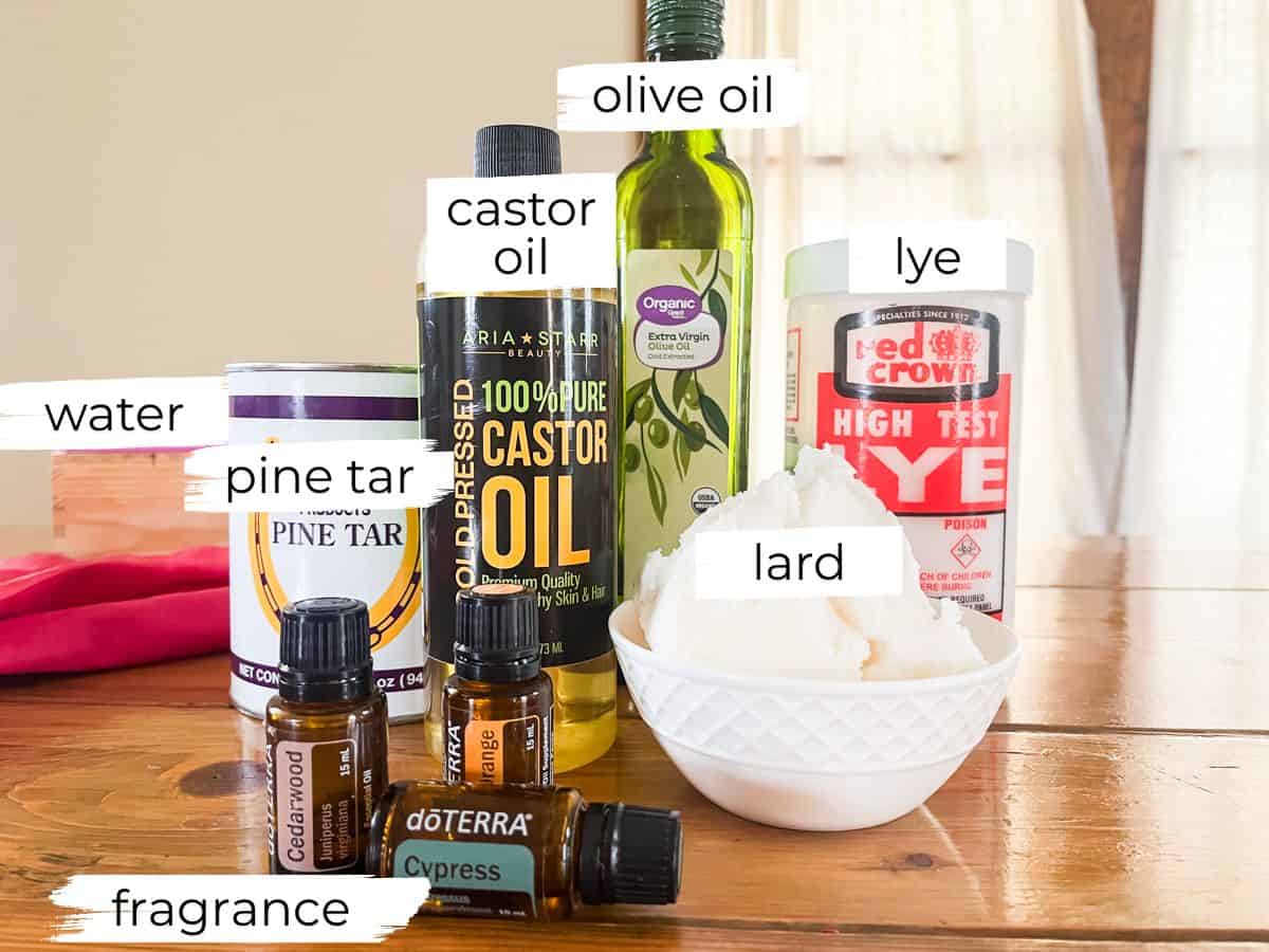 Pine tar soap ingredients labeled on a wooden table. 