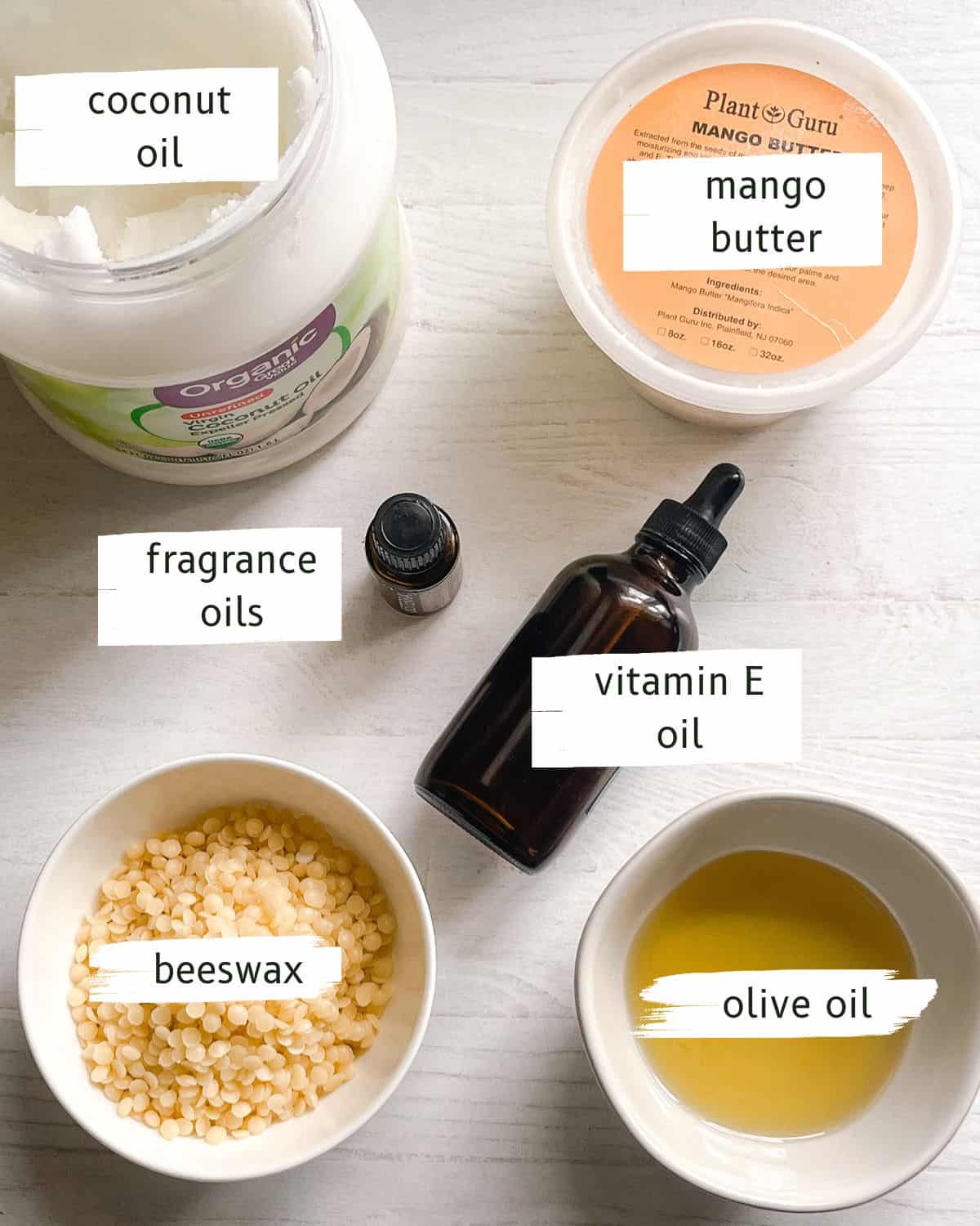Beard conditioning balm ingredients labeled on a white backdrop. 