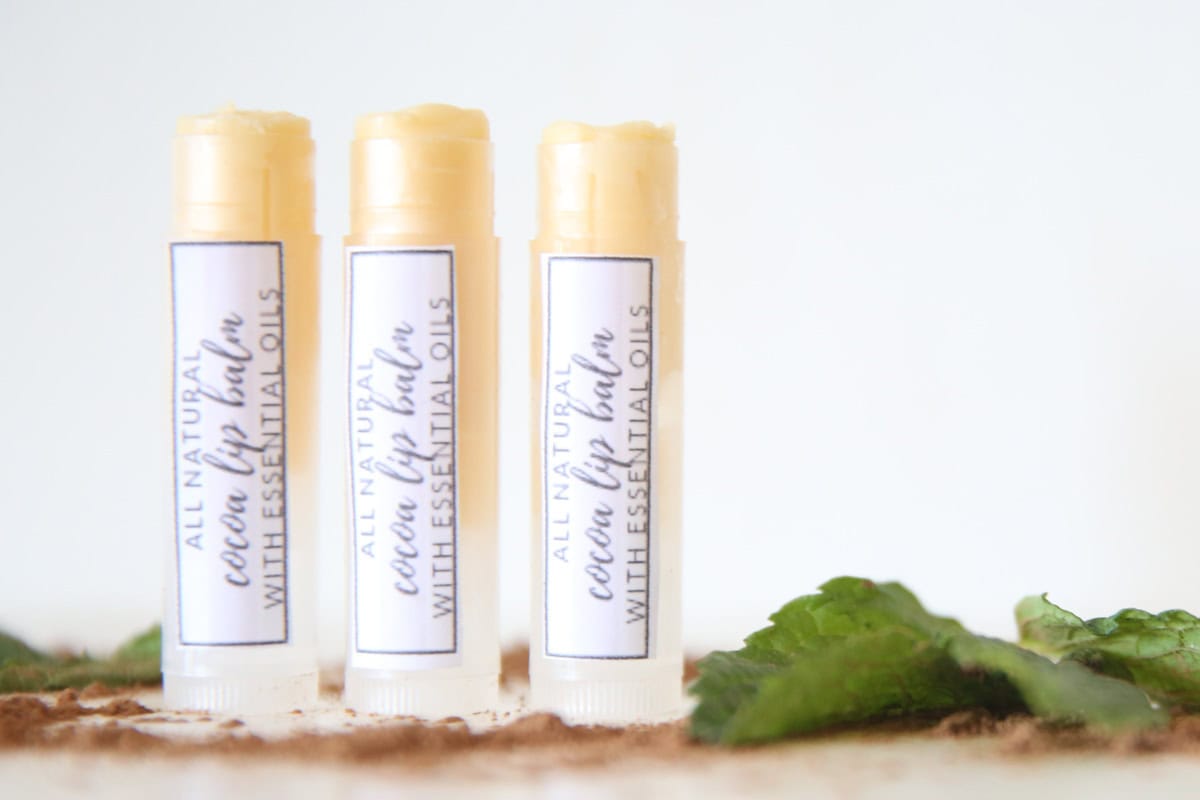 DIY lip balm in three reusable tubes with a homemade label. 