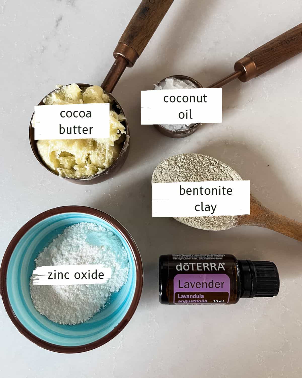 DIY diaper cream ingredients labeled on a white backdrop. 