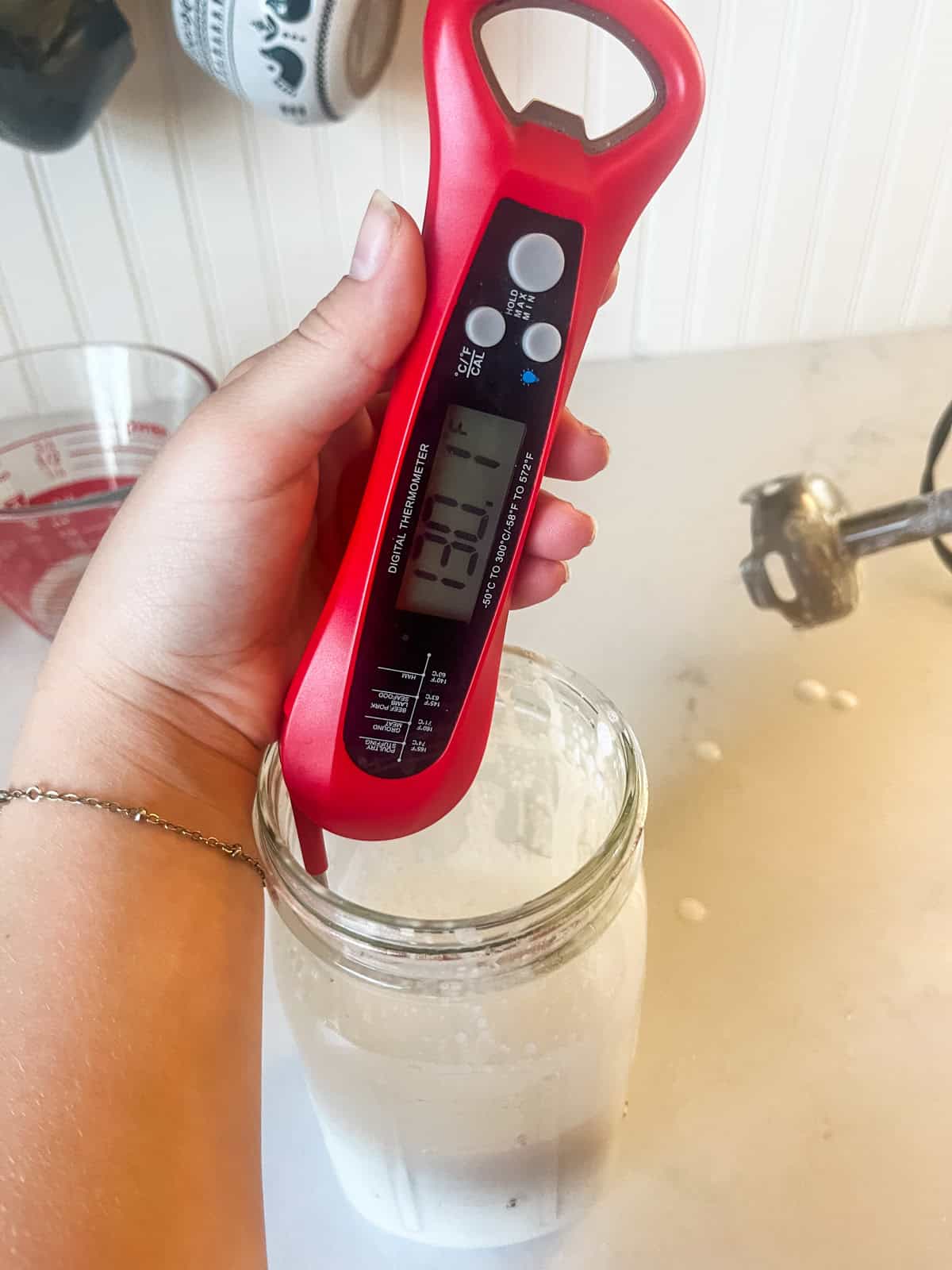 A digital thermometer dipped in the jar of lotion with a reading of 130.1 degrees.