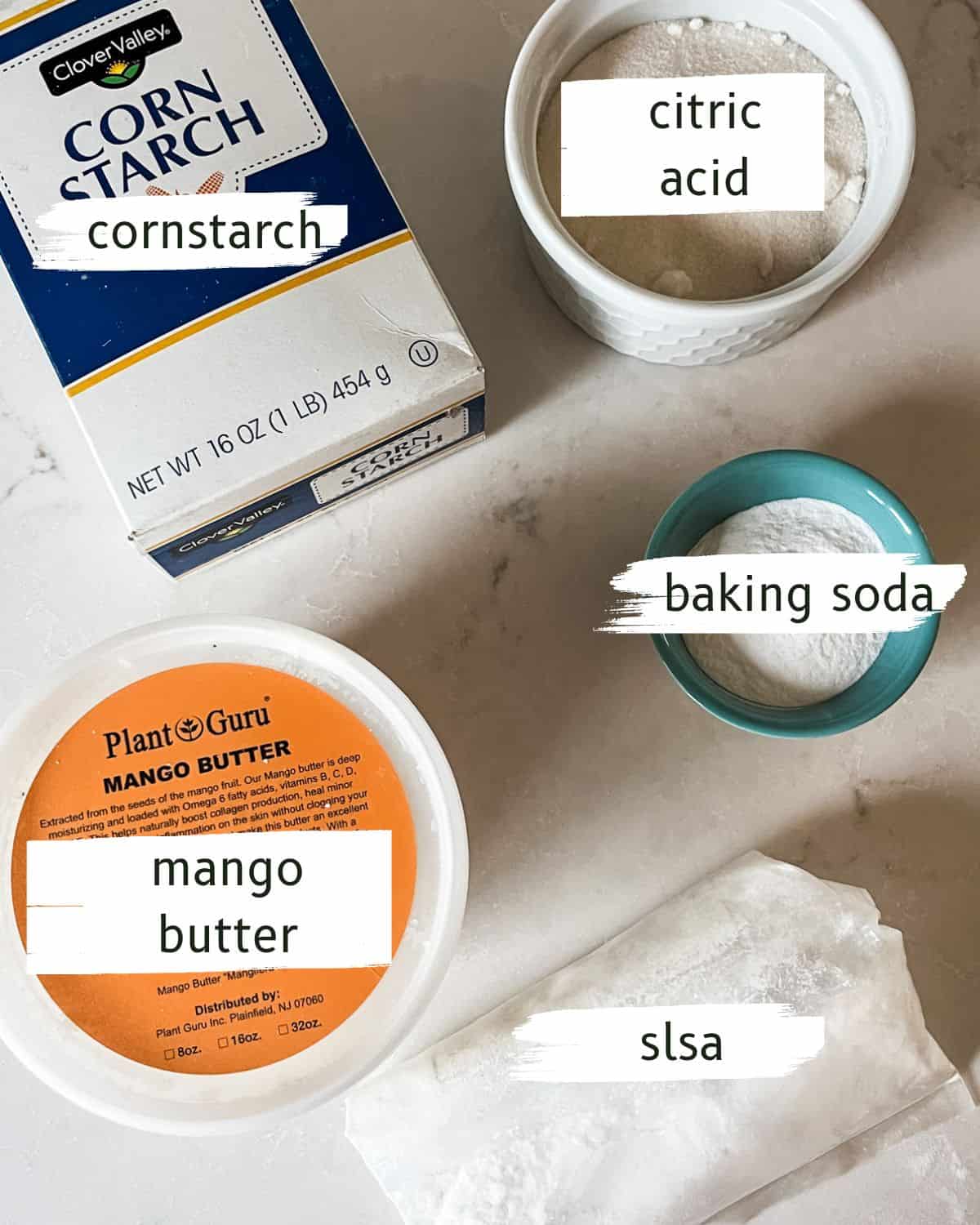 Bubble bath bar ingredients labeled on a kitchen counter. 