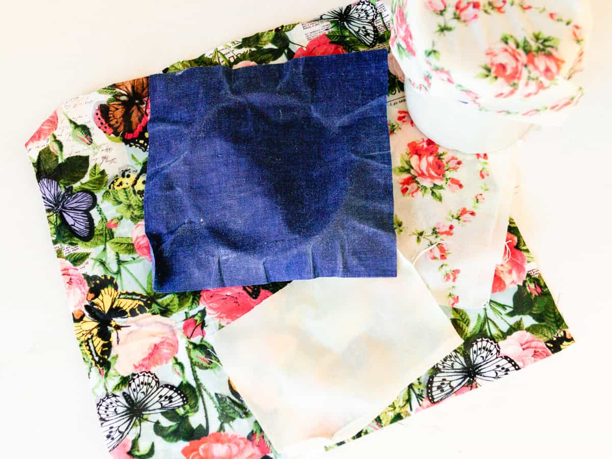 Beeswax wraps stacked on a kitchen counter.