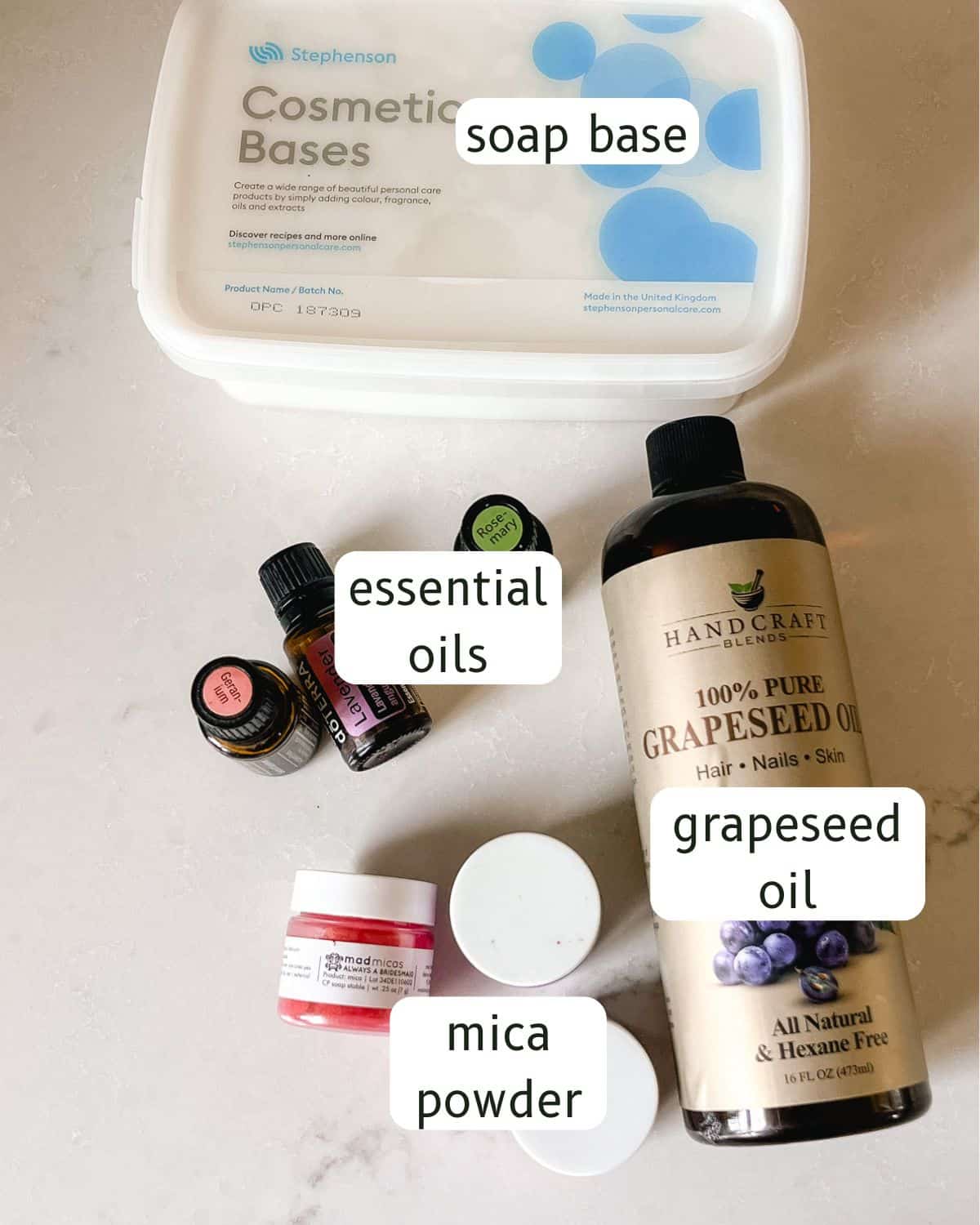 Foaming sugar scrub ingredients labeled on a countertop. 