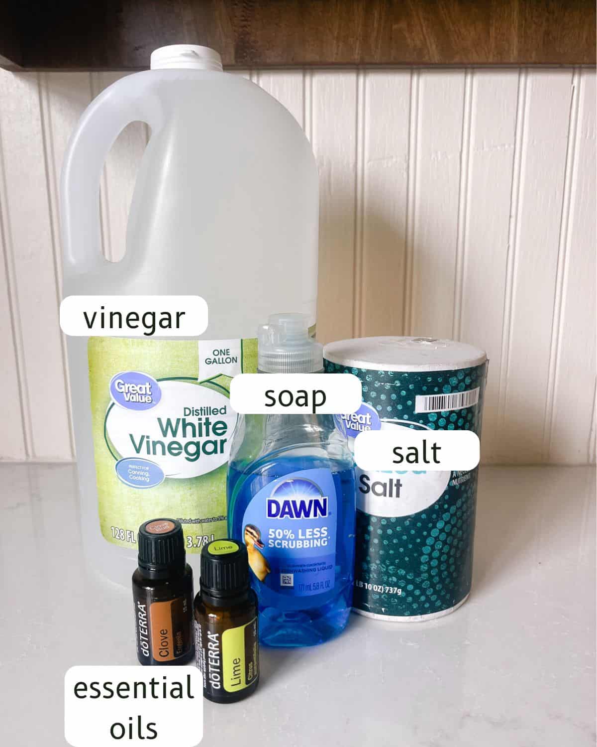 Natural weed killer ingredients labeled on a ktichen counter.