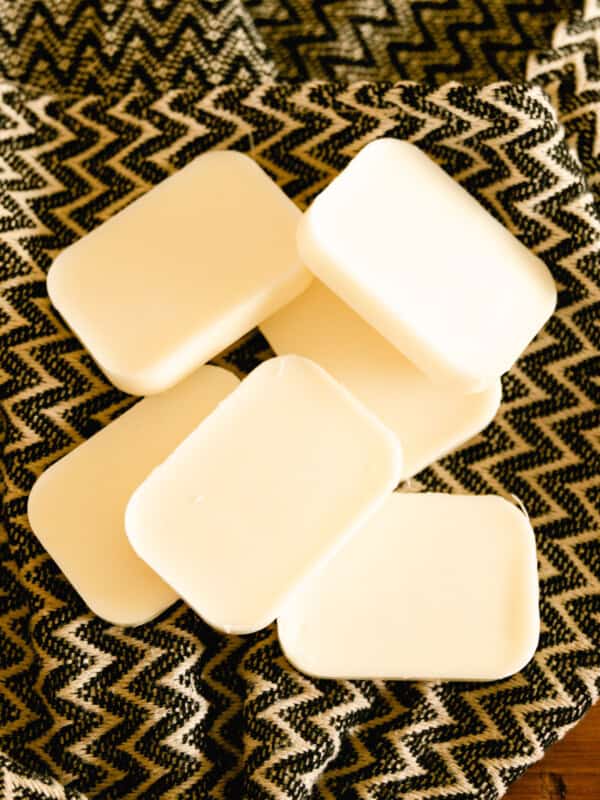 Solid conditioner bars on a patterned towel.