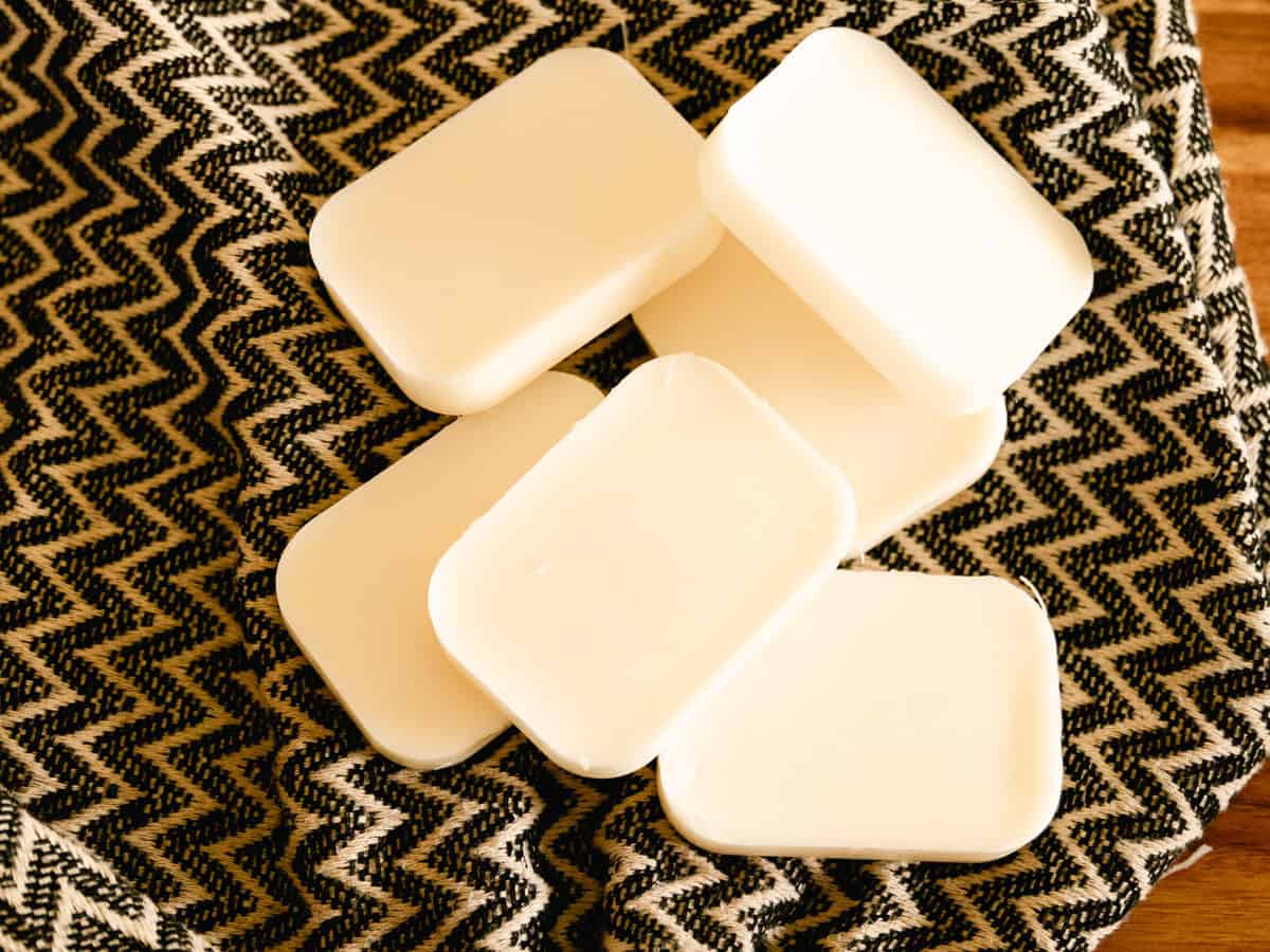 Solid conditioner bars on a patterned towel.