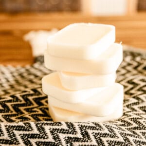 A stack of conditioner bars on a patterned towel.