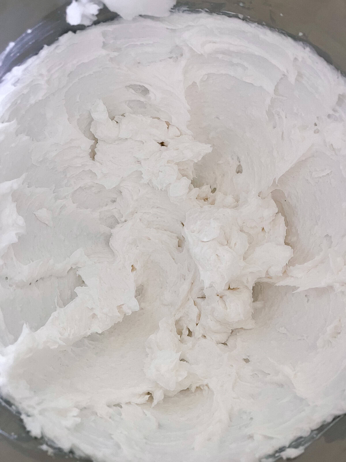 Whipped soap base in a mixing bowl. 