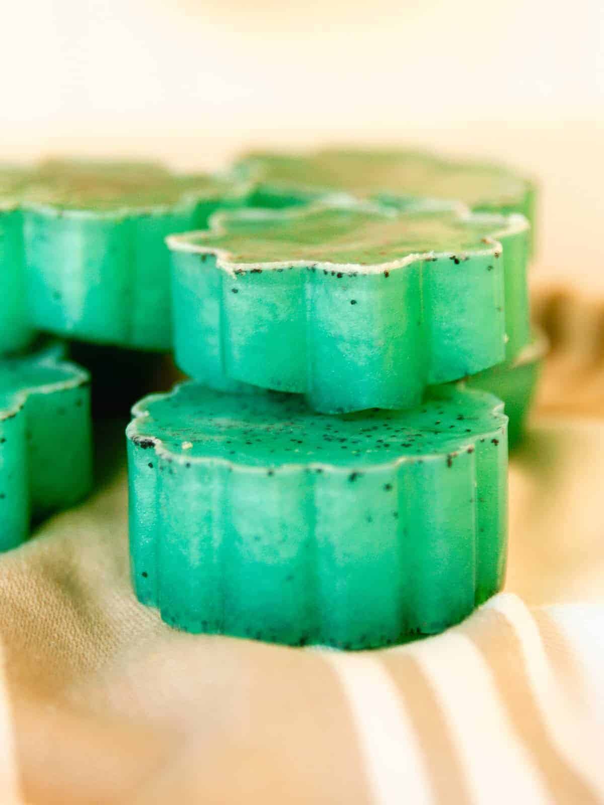 Green soap bars stacked in a small pile.