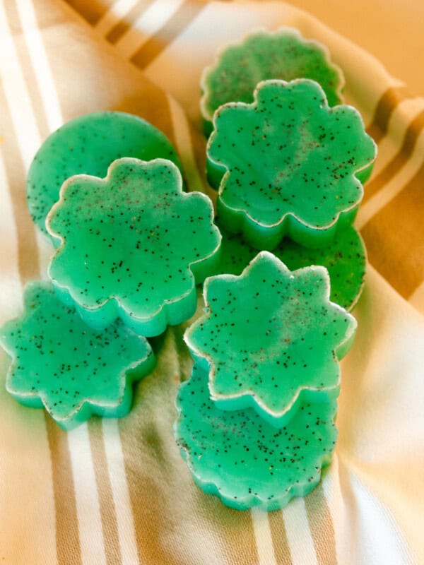 Mint lime melt and pour soap bars stacked on a linen.